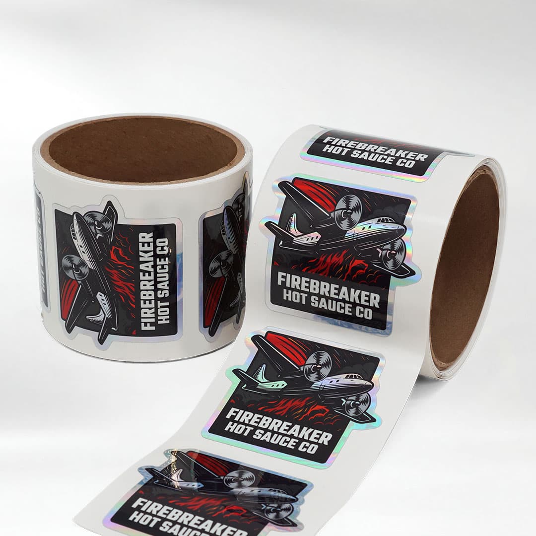 Firebreaker Hot Sauce Co. holographic kiss cut roll stickers with an iridescent finish and easy peel liner.