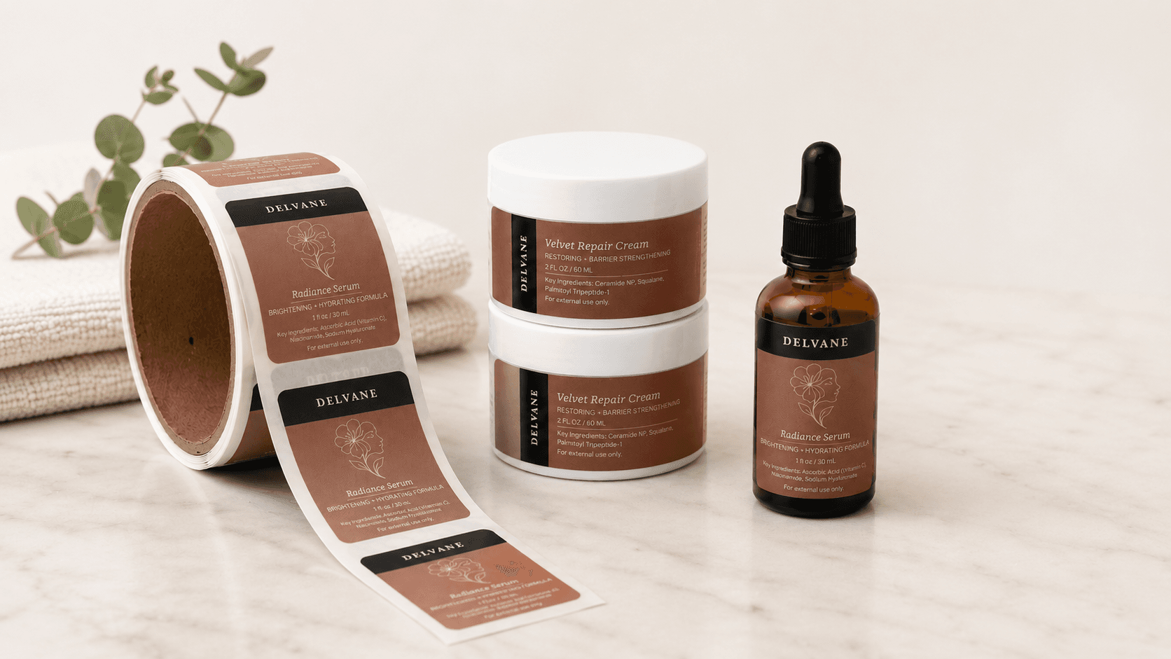Custom skincare roll labels displayed with a labeled serum bottle and cream jars to showcase premium beauty product packaging.