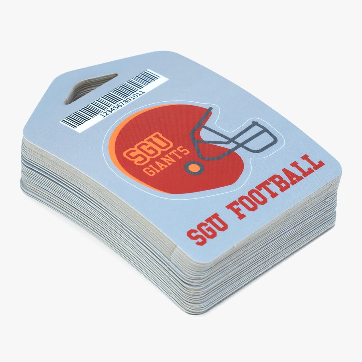 Stack of custom football hang tag sticker sheets with barcode and helmet design