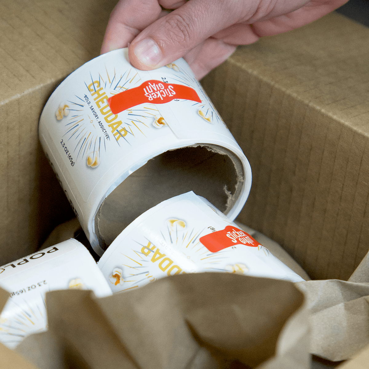 StickerGiant team packing custom label orders for shipping and delivery.