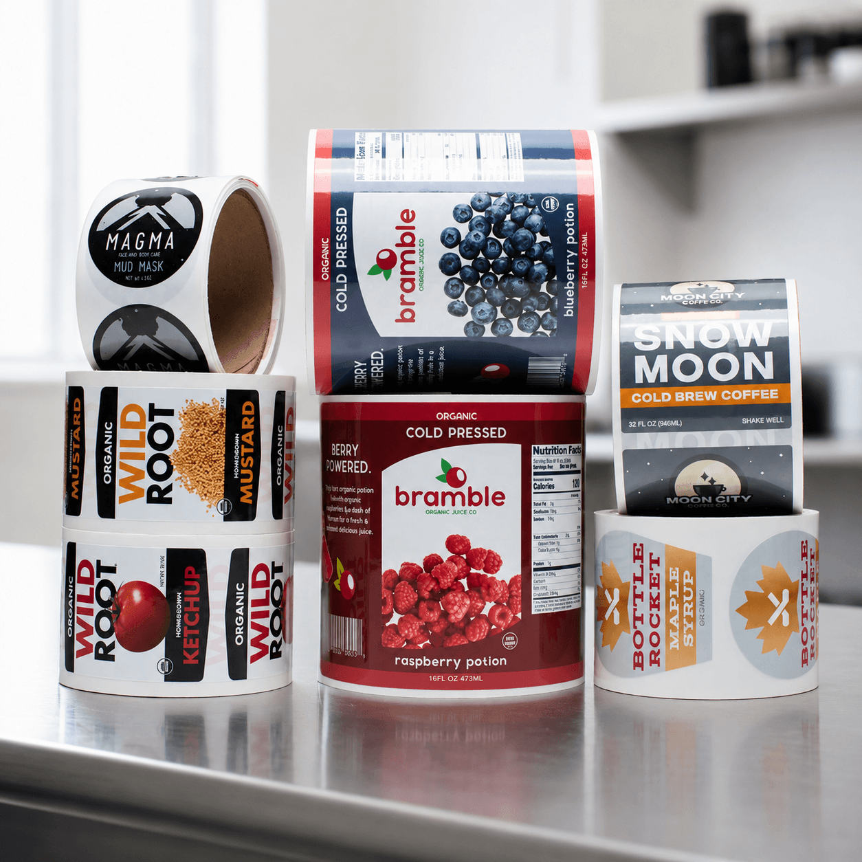 Custom roll labels for food, beverage, coffee, and personal care products displayed on rolls, showcasing high quality product labels for retail packaging.