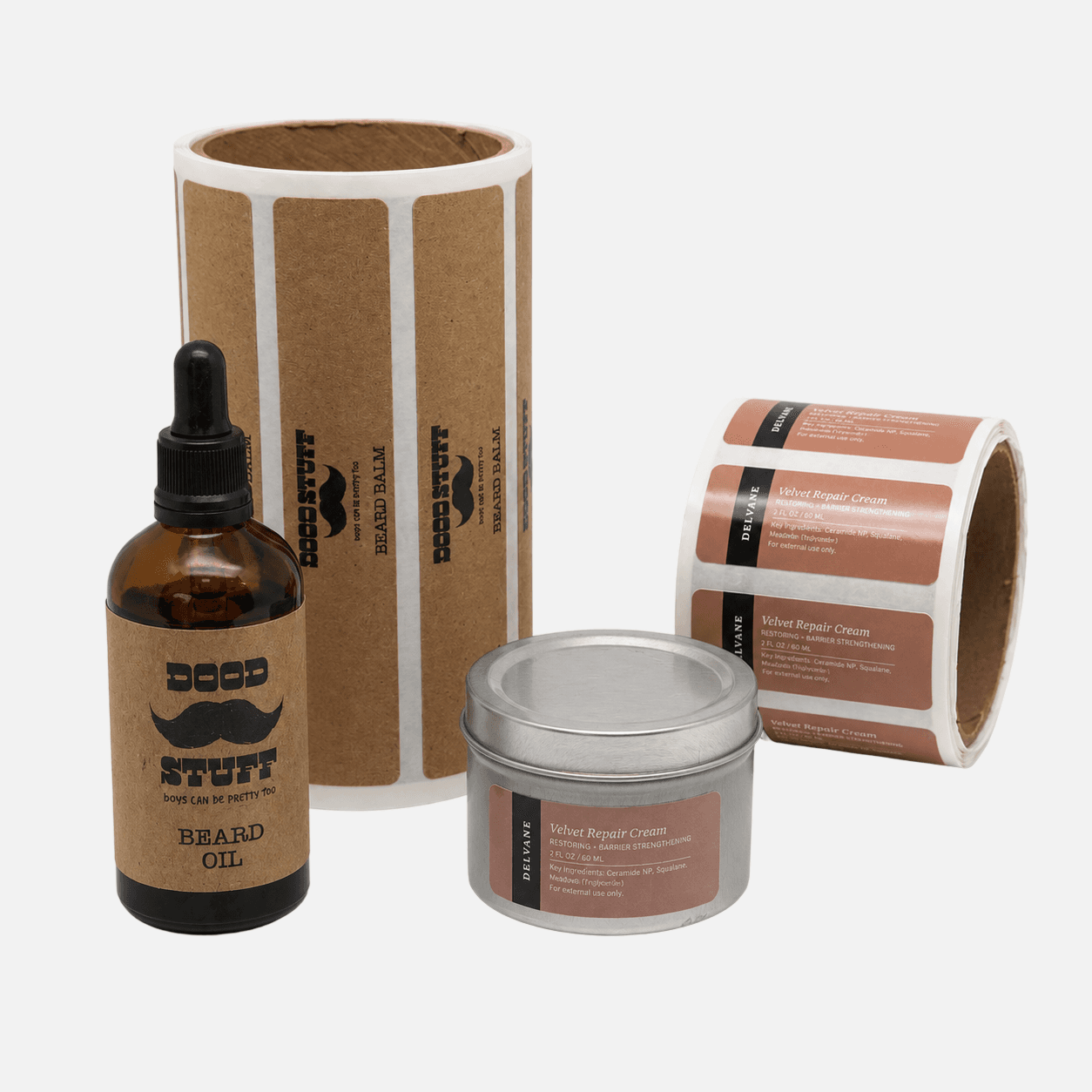 Custom paper labels for beauty and personal care products applied to skincare jars and beard oil bottles with matching paper label rolls.