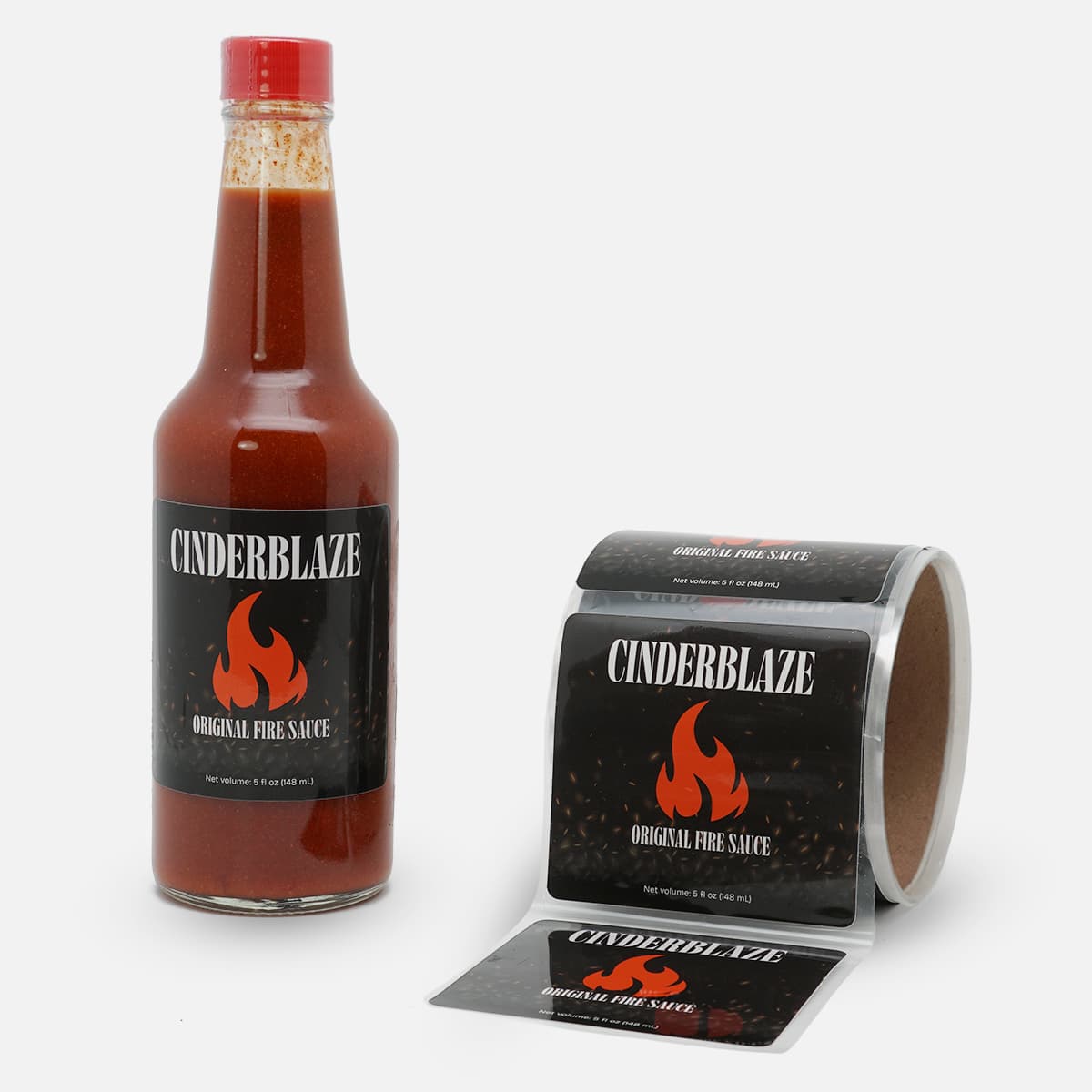 Glossy food labels with PET backing applied to hot sauce bottles and supplied on rolls for automated label application.