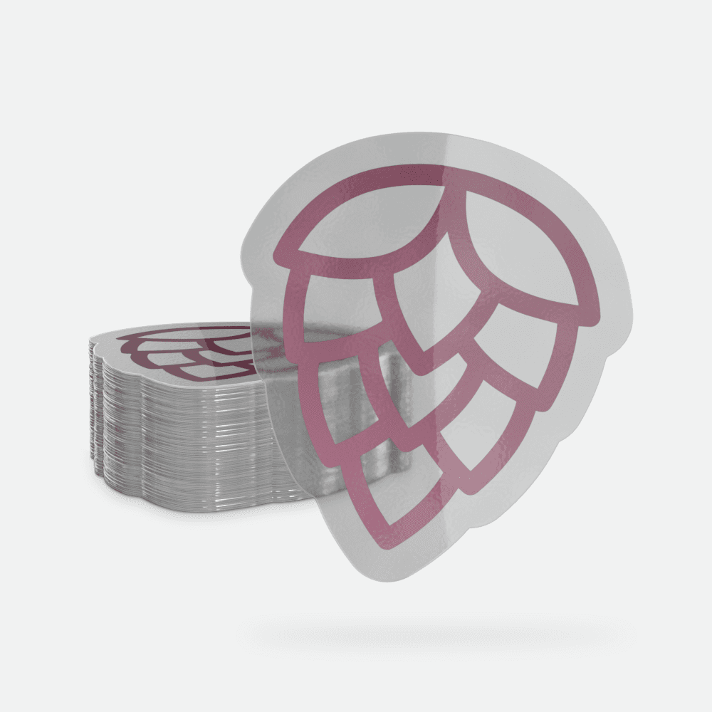 A translucent die-cut sticker with a pink hop cone design appears in front of a stack of matching stickers on a light gray background.
