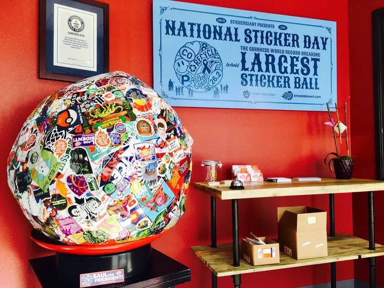 StickerGiant's Guinness World Record largest sticker ball displayed in the company lobby for National Sticker Day.