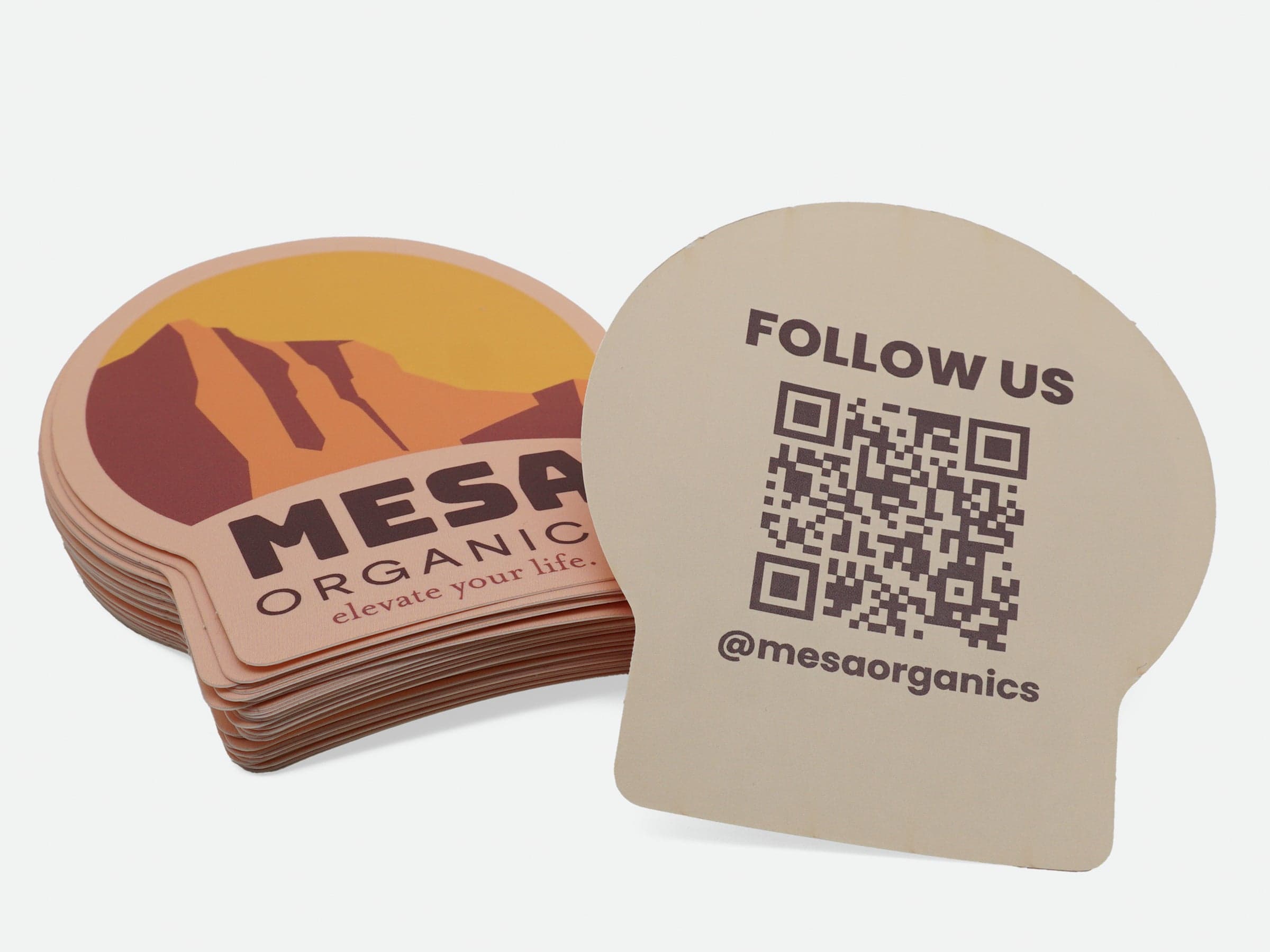 Custom shaped backprinted stickers featuring branding on the front and a QR code on the reverse side.