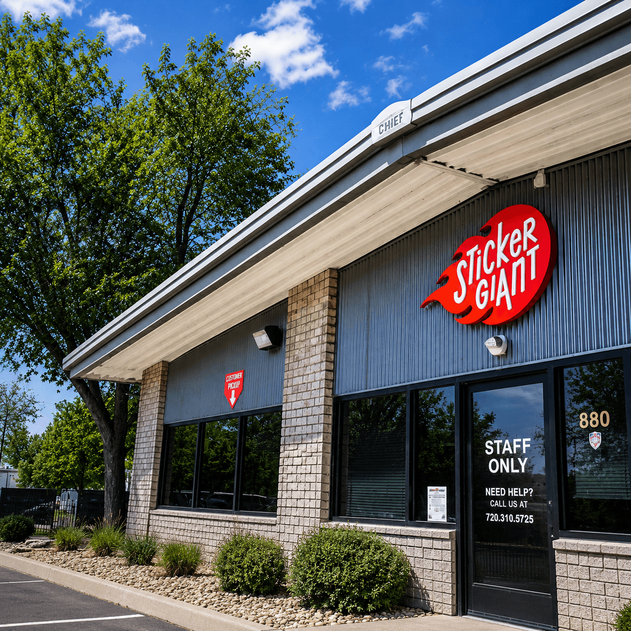 StickerGiant's Colorado printing facility exterior with company sign, showcasing local custom sticker and label manufacturing.