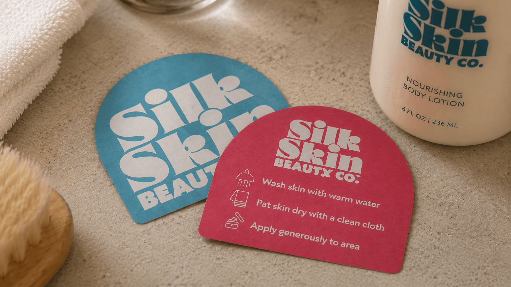 Backprinted beauty brand stickers displayed beside a body lotion bottle.