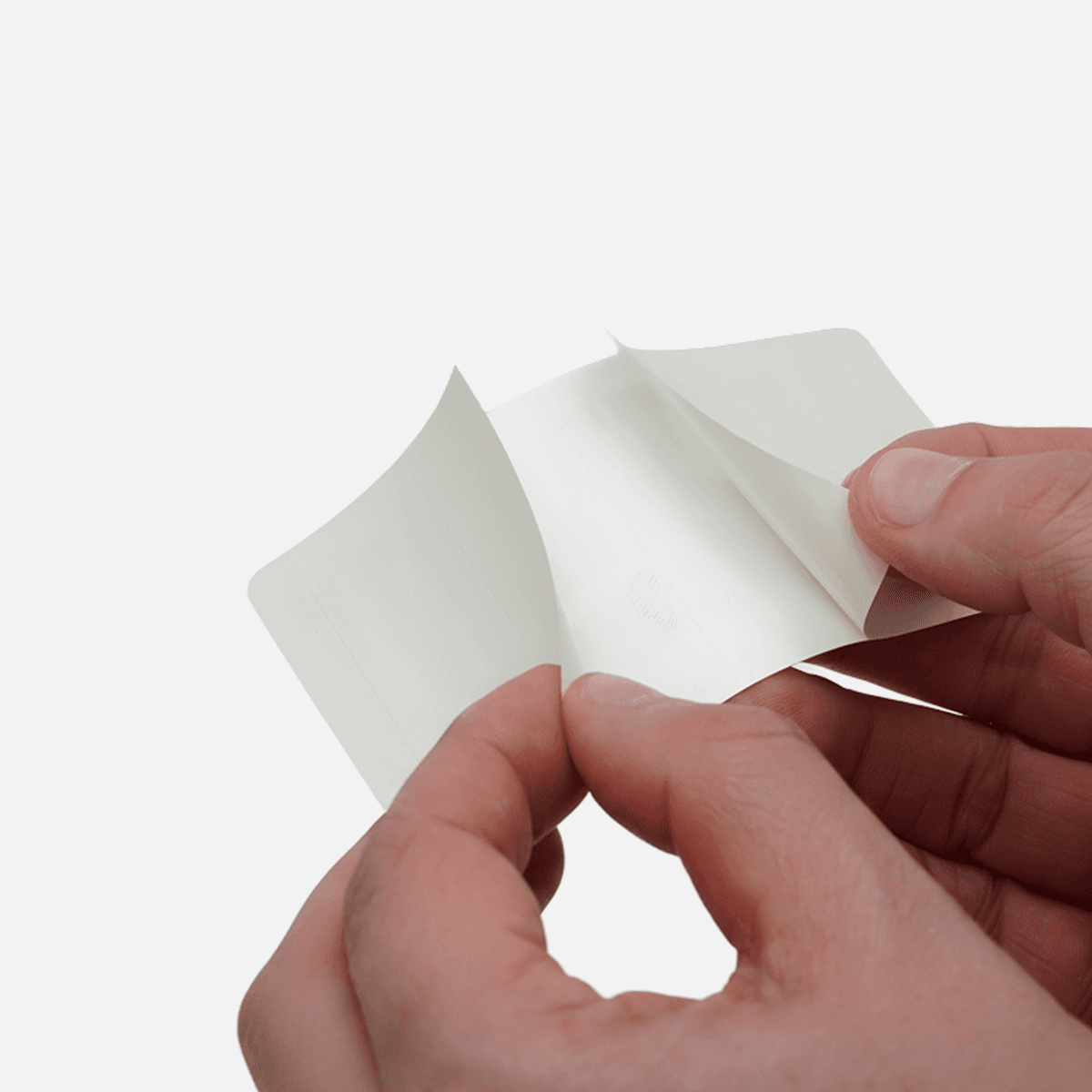 Rectangular custom sticker with split backing opened to demonstrate easy peel application.