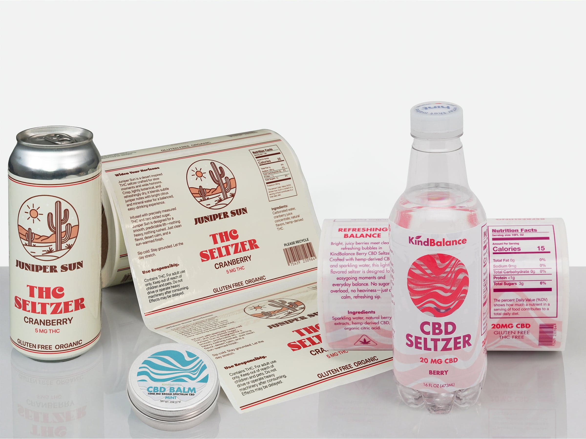 Custom BOPP beverage labels displayed on a cannabis seltzer can with printed label rolls.