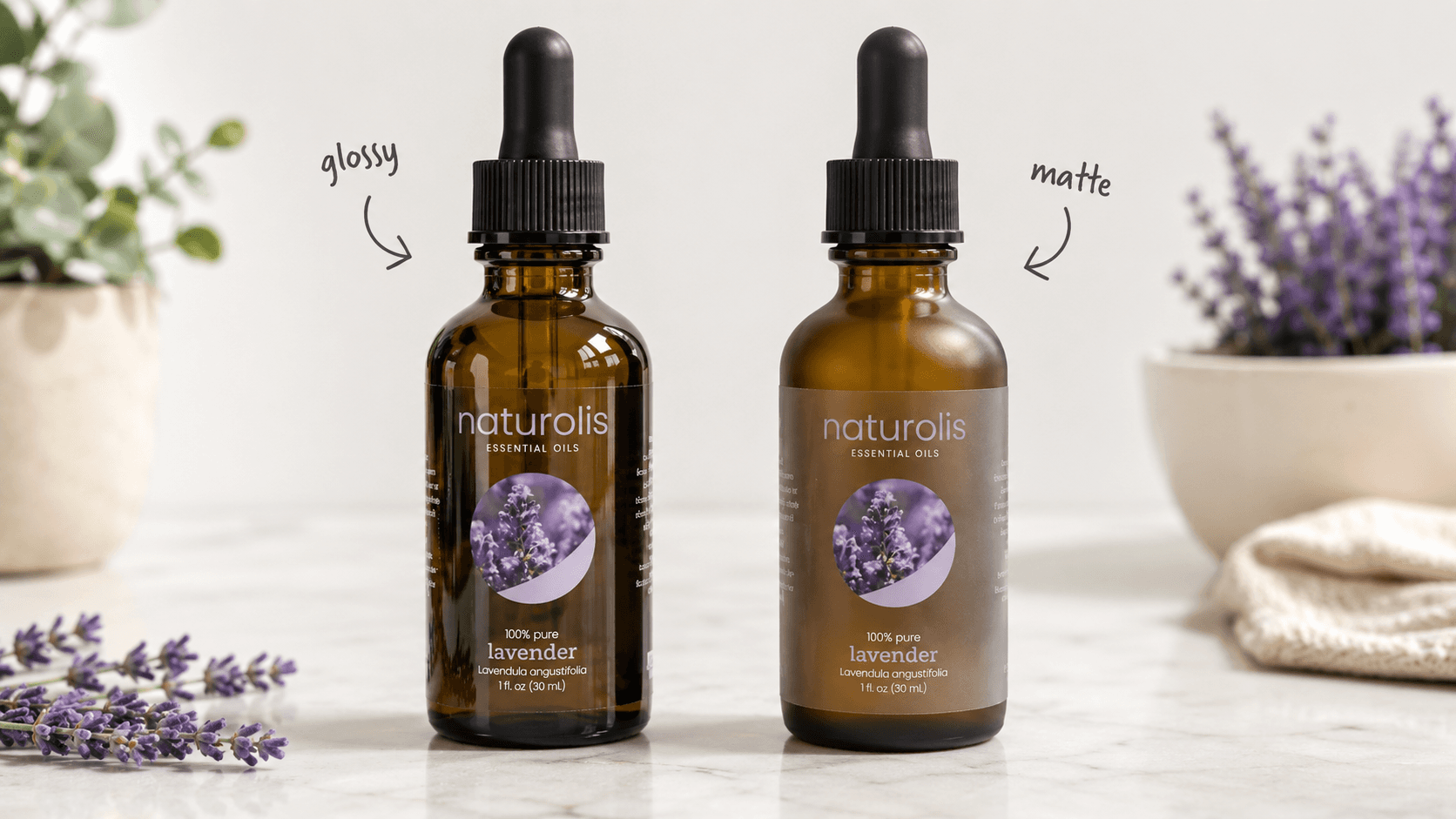 Comparison of glossy and matte clear labels on amber essential oil bottles, showing the transparent glossy finish and the frosted appearance of matte clear labels.