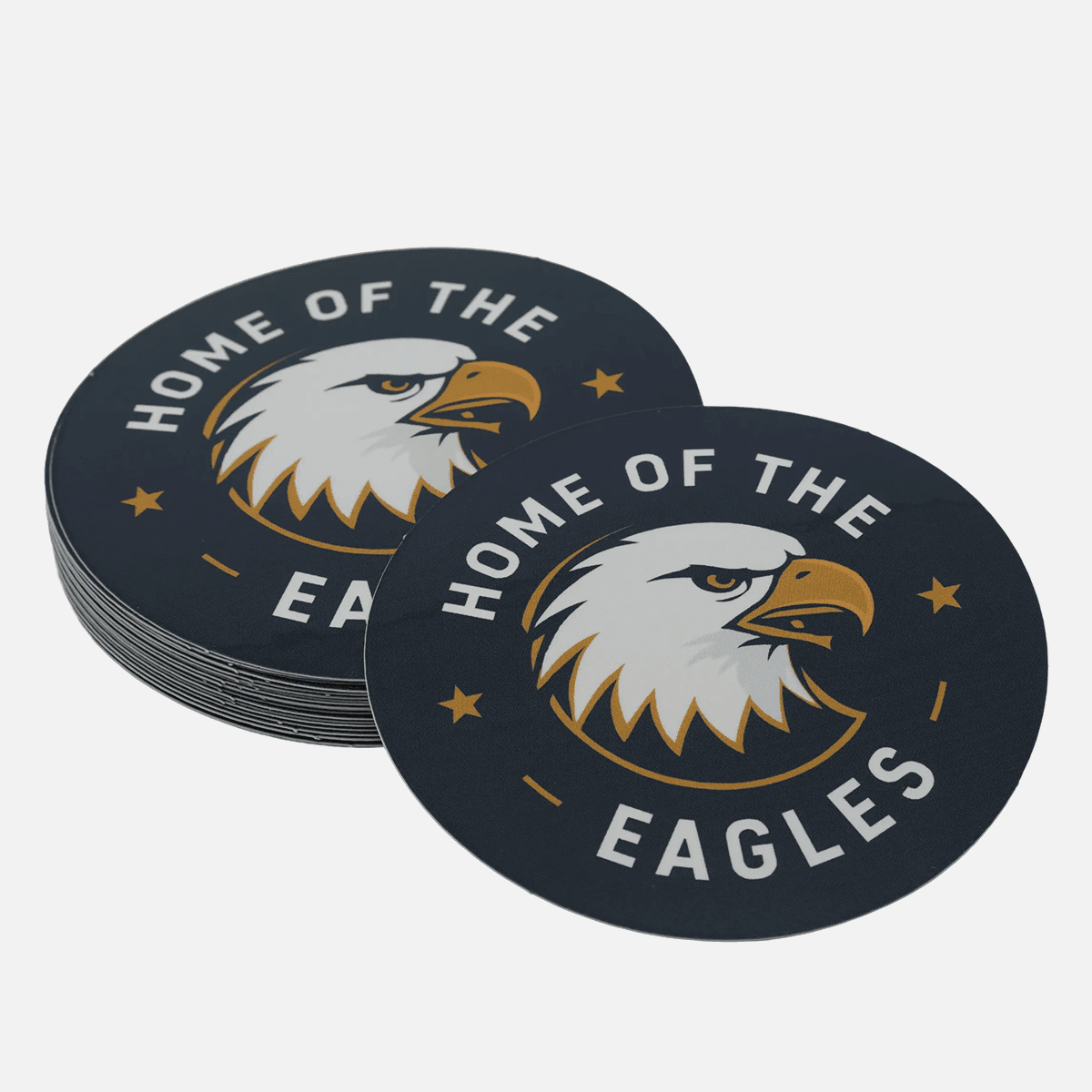Stack of custom round eagle logo stickers with a single sticker displayed in front.