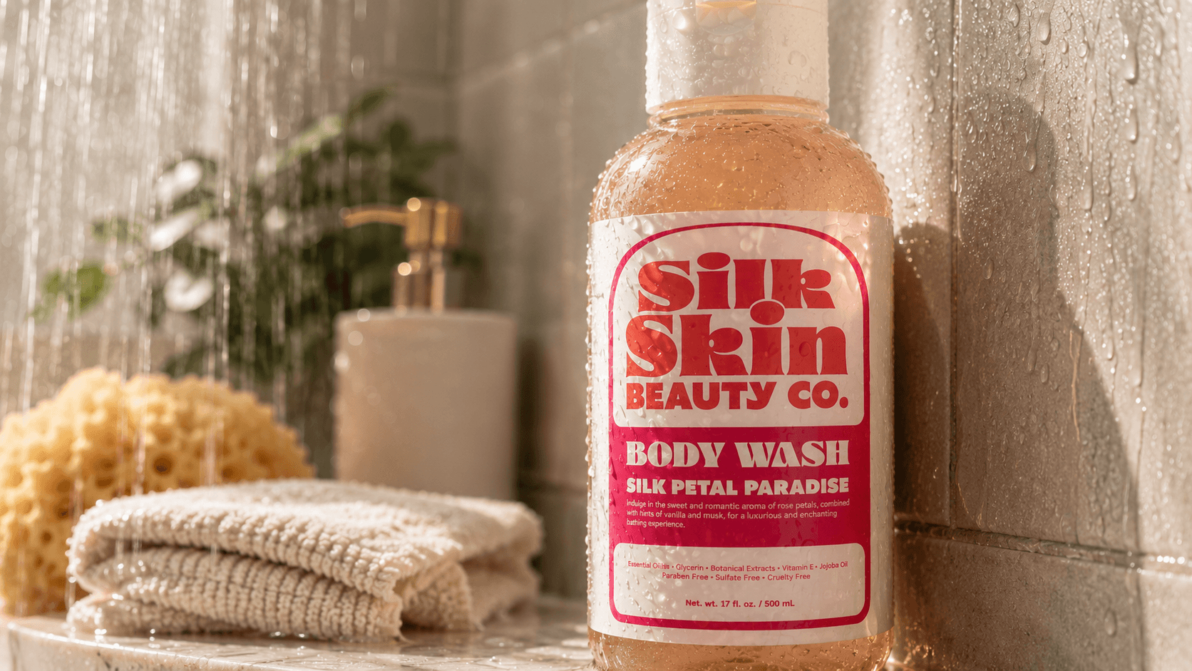 Custom laminated label applied to a body wash bottle in a shower setting, demonstrating durable water-resistant labels for beauty, skincare, and personal care packaging.