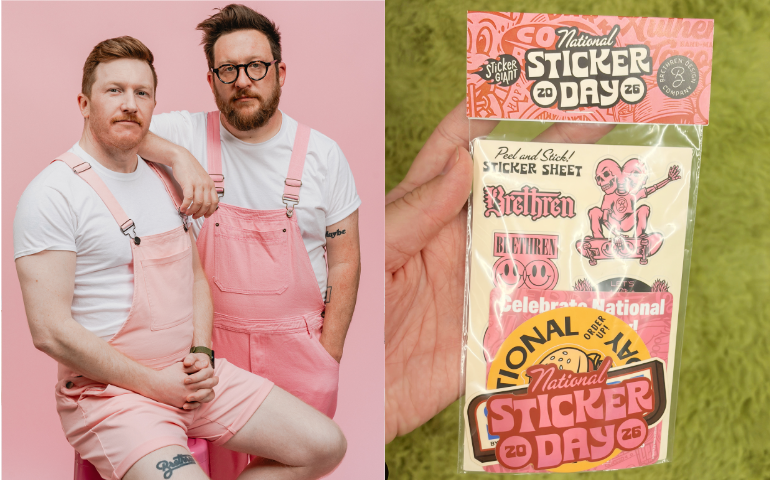 Two people in pink overalls pose against a pink backdrop; next to them, a hand holds a packaged National Sticker Day sticker pack.