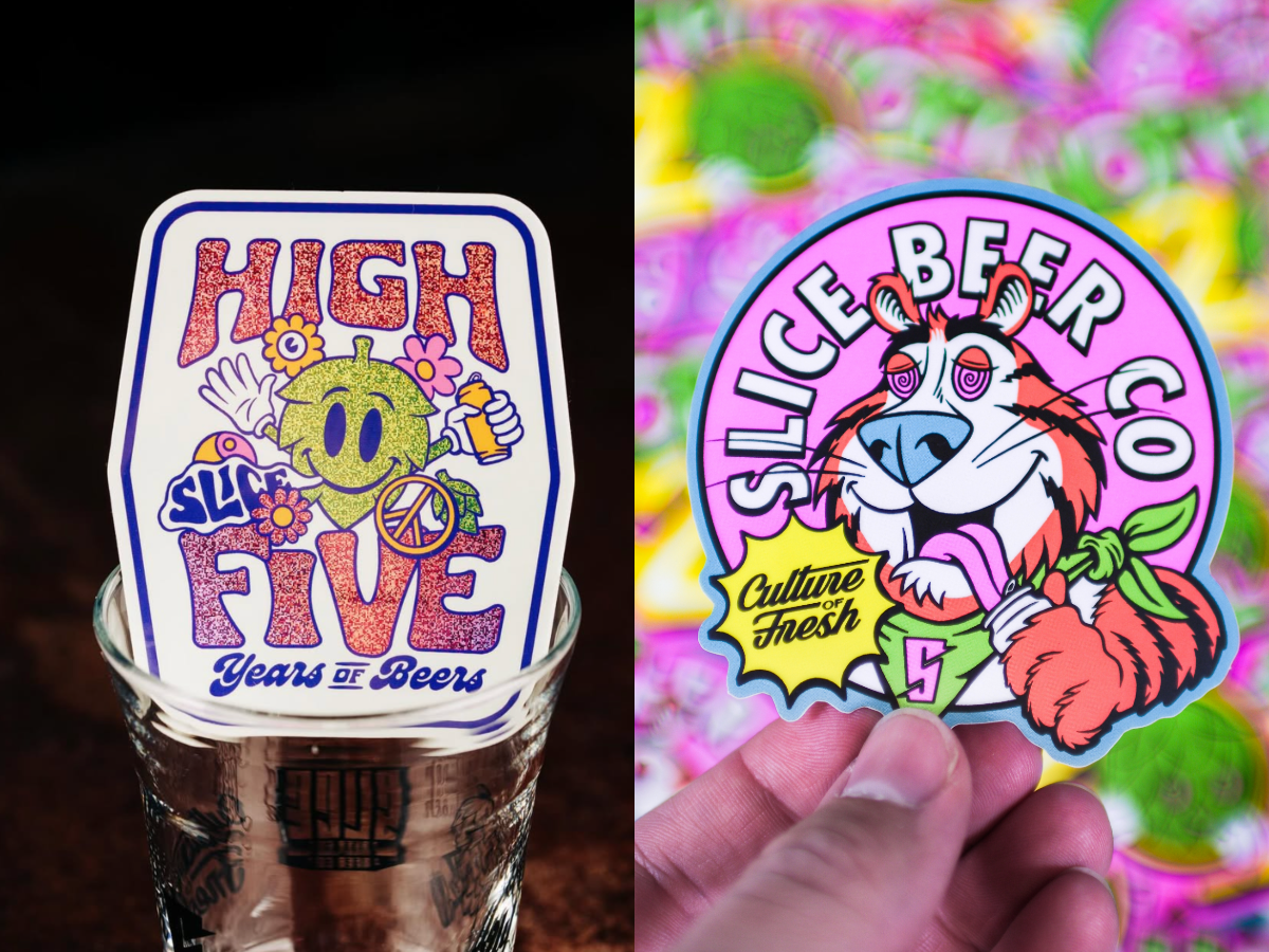 Two colorful beer-themed stickers: one glittery &lsquo;High Five Years of Beers&rsquo; design in a glass, and one round &lsquo;Slice Beer Co&rsquo; tiger mascot sticker held in a hand.