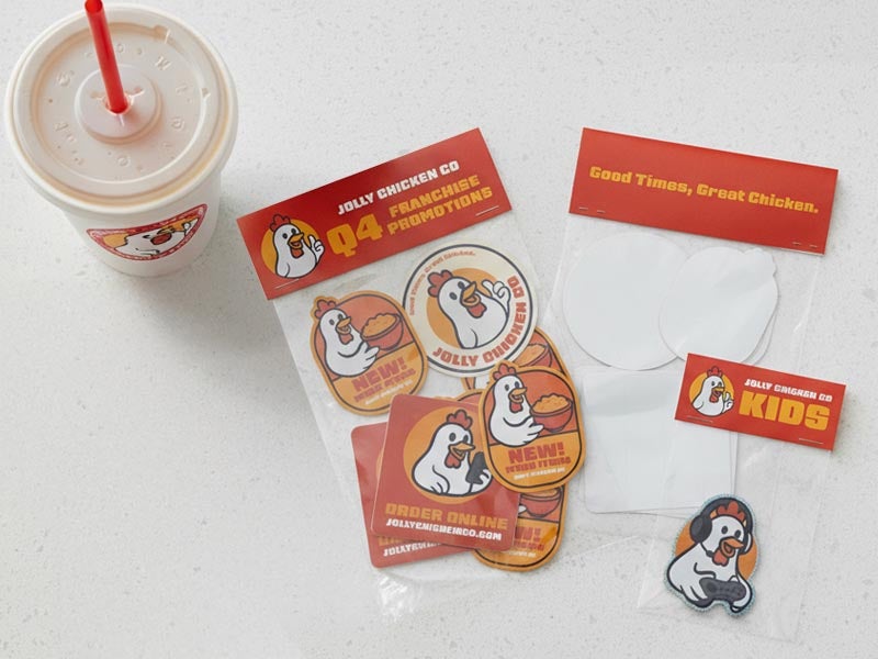 Branded chicken restaurant sticker packs with red header cards for franchise promotions and kids’ giveaways.