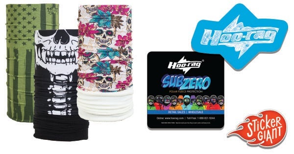 A group of colorful Hoo-Rag wearable bandanas in various skull and patterned designs displayed alongside Hoo-Rag Sub Zero packaging and branded logo stickers printed by StickerGiant.