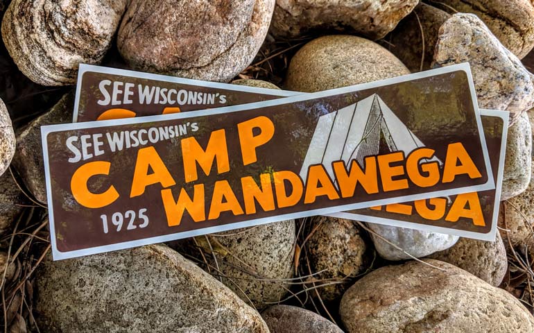 Camp Wandawega bumper stickers on rocks.