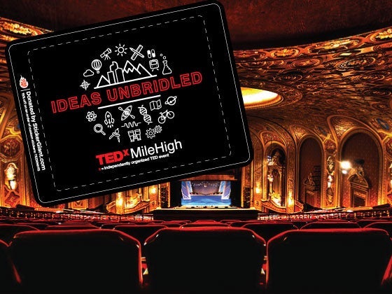 Custom TEDxMileHigh Ideas Unbridled sticker displayed over a view of the ornate interior of the Ellie Caulkins Opera House, showing red theater seating, gold architectural detailing, and the stage.