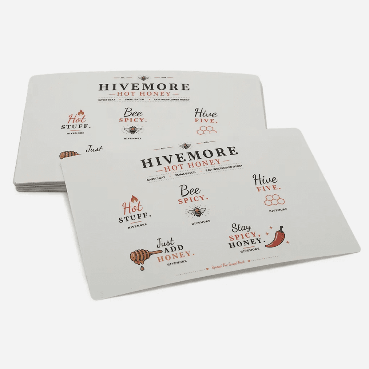 Clear sticker sheets with custom honey brand logos and product graphics for packaging and promotional use.